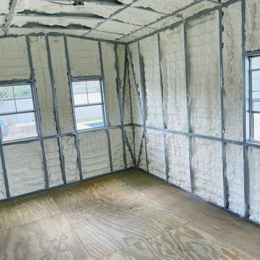 Closed-cell spray foam insulation applied to wall cavities in a residential project in Hollister